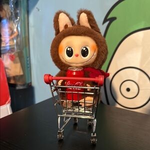 Plush keychain in shopping cart
